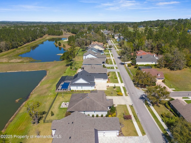 aerial view with a residential view and a water view