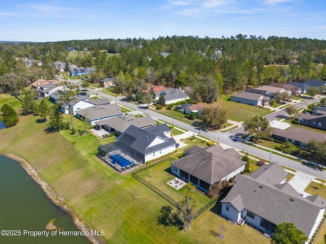 bird's eye view with a residential view and a water view