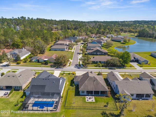 bird's eye view featuring a water view and a residential view