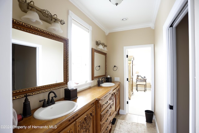 full bath featuring ornamental molding, plenty of natural light, and a sink