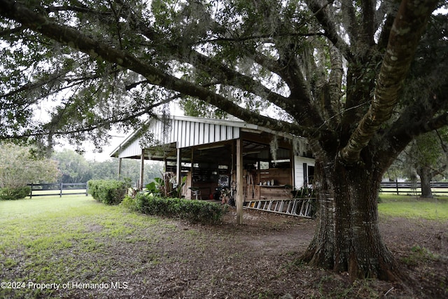 exterior space with fence and an outdoor structure