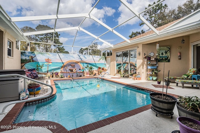 outdoor pool featuring a patio and a lanai