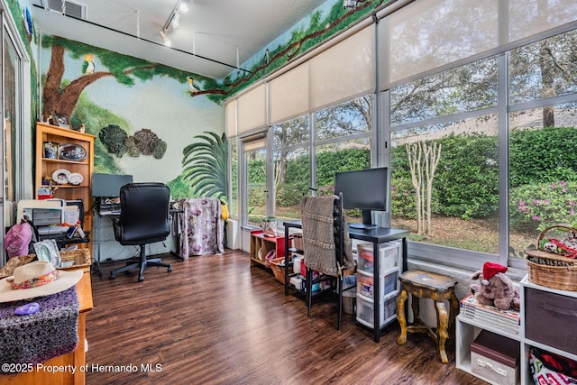 office space with rail lighting, visible vents, and wood finished floors