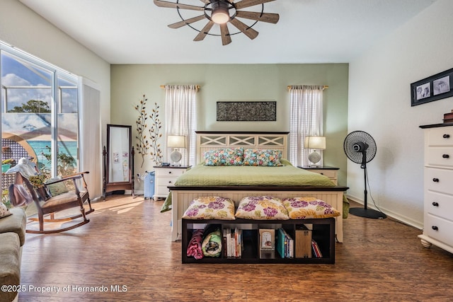 bedroom featuring a ceiling fan, access to outside, baseboards, and wood finished floors