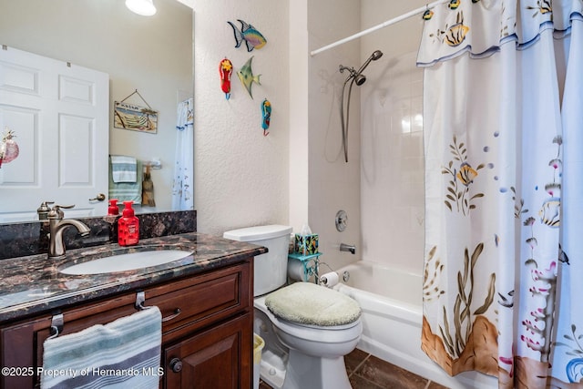 bathroom featuring a textured wall, toilet, shower / tub combo, vanity, and tile patterned floors