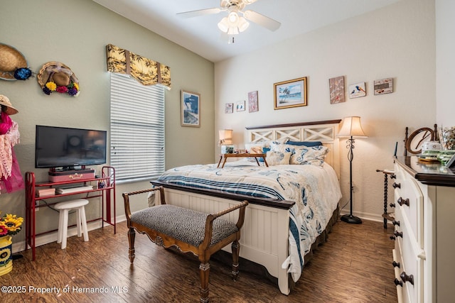 bedroom featuring a ceiling fan, baseboards, and wood finished floors