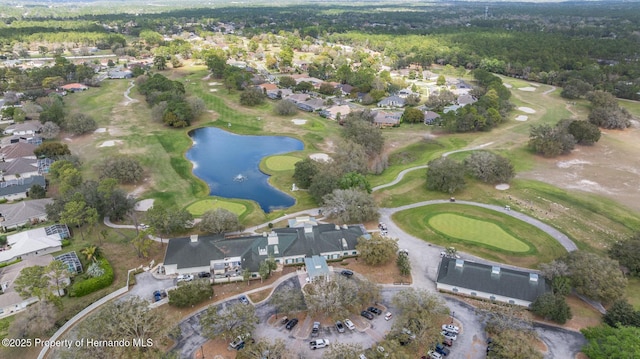 aerial view featuring a residential view, view of golf course, and a water view