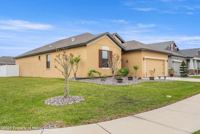 ranch-style home with driveway, a garage, fence, a front lawn, and stucco siding