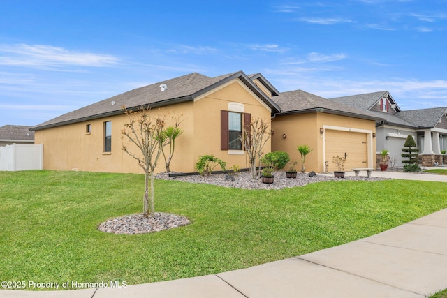 single story home featuring stucco siding, a front yard, fence, a garage, and driveway