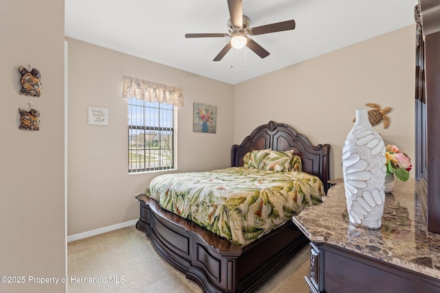 bedroom with baseboards, a ceiling fan, and light colored carpet