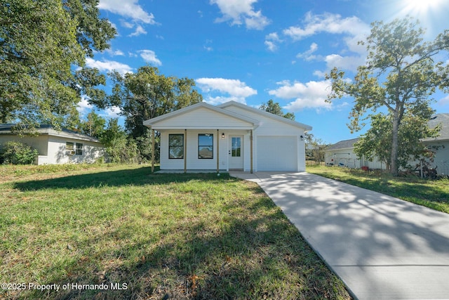 view of front of property with a garage, concrete driveway, and a front yard