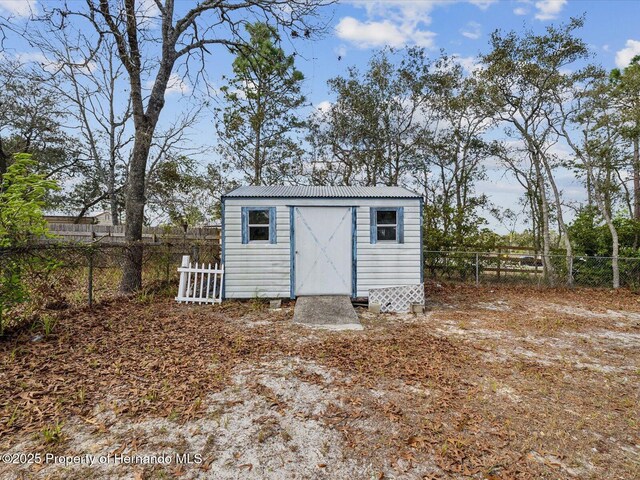 view of shed with a fenced backyard