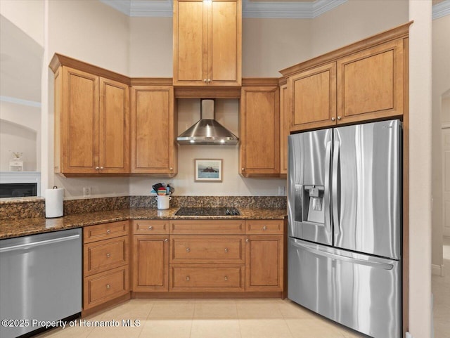 kitchen with stainless steel appliances, crown molding, and wall chimney range hood