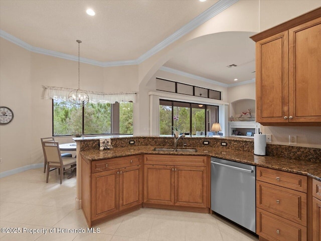 kitchen with a sink, brown cabinets, dishwasher, dark stone countertops, and crown molding