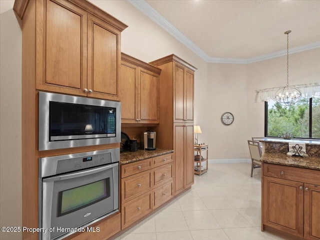 kitchen featuring brown cabinetry, ornamental molding, dark stone countertops, oven, and built in microwave