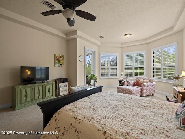 bedroom with baseboards, visible vents, a textured ceiling, and carpet flooring