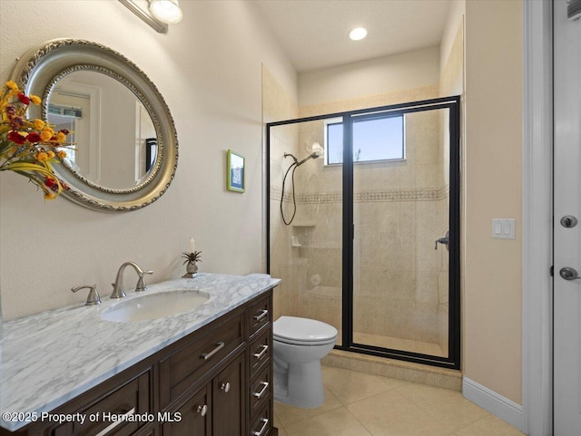 full bath with toilet, vanity, baseboards, tile patterned floors, and a stall shower