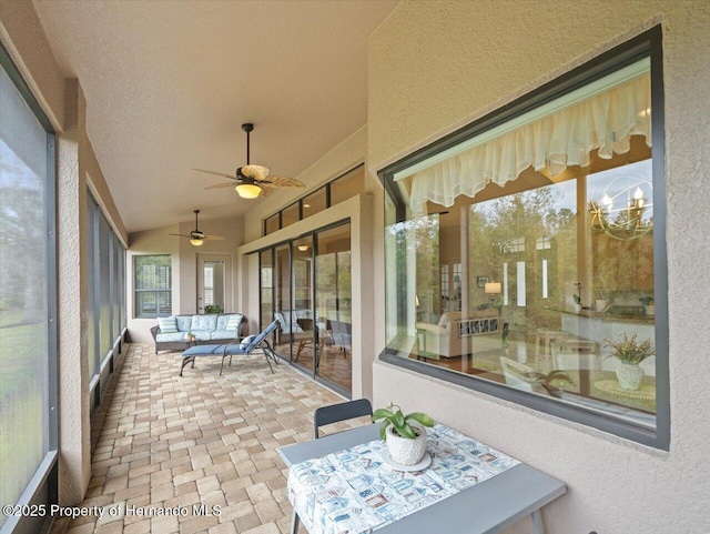 sunroom / solarium featuring vaulted ceiling