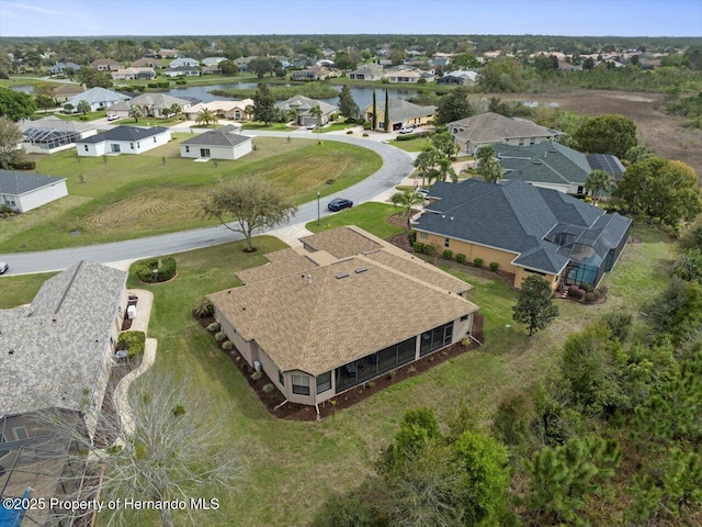 birds eye view of property with a residential view