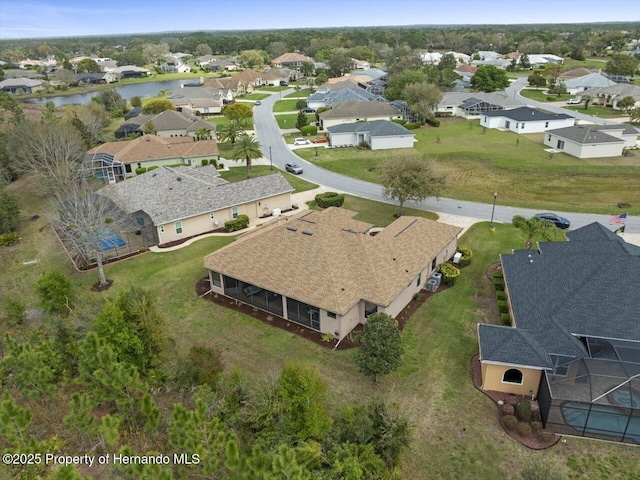 aerial view with a water view and a residential view