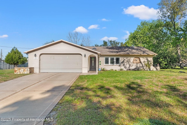 ranch-style home featuring stucco siding, a garage, concrete driveway, and a front lawn