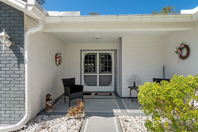 property entrance featuring covered porch