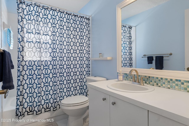 bathroom featuring decorative backsplash, toilet, and vanity