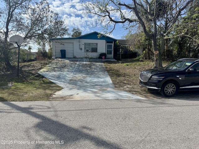 view of front of property with a garage and driveway