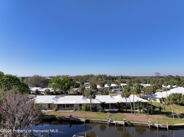 bird's eye view featuring a residential view and a water view