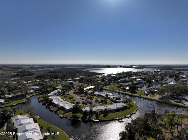 birds eye view of property with a water view and a residential view