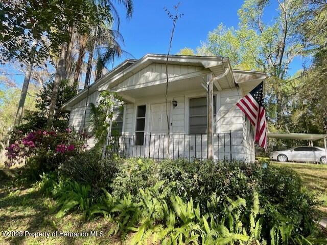 view of home's exterior with covered porch