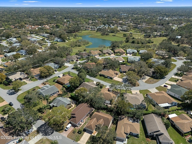 drone / aerial view with a residential view and a water view