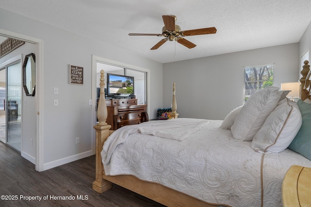 bedroom featuring a textured ceiling, a ceiling fan, baseboards, and wood finished floors