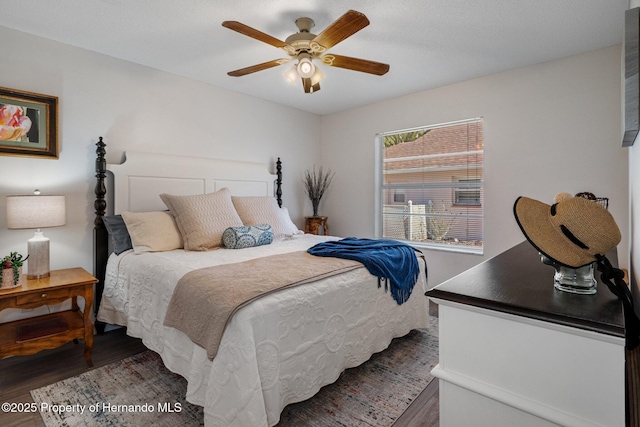 bedroom with wood finished floors and a ceiling fan