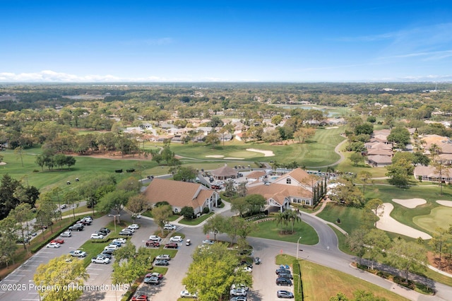 birds eye view of property with golf course view