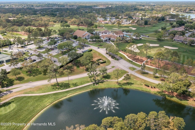 birds eye view of property featuring golf course view, a water view, and a residential view