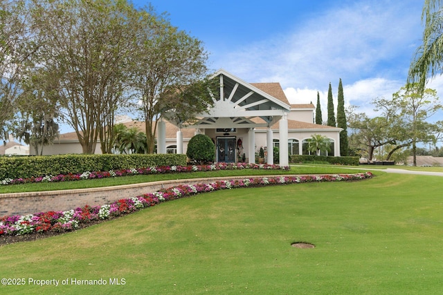 view of property's community with a lawn