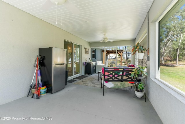 sunroom / solarium with ceiling fan