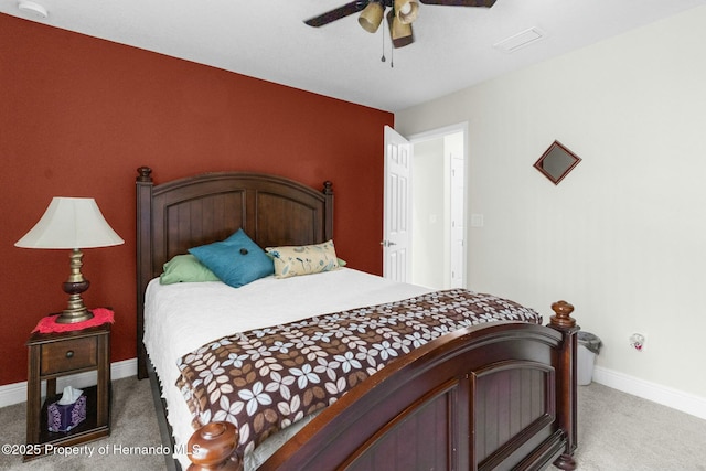 bedroom featuring carpet floors, visible vents, baseboards, and a ceiling fan