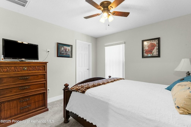 bedroom featuring light colored carpet, visible vents, ceiling fan, and baseboards