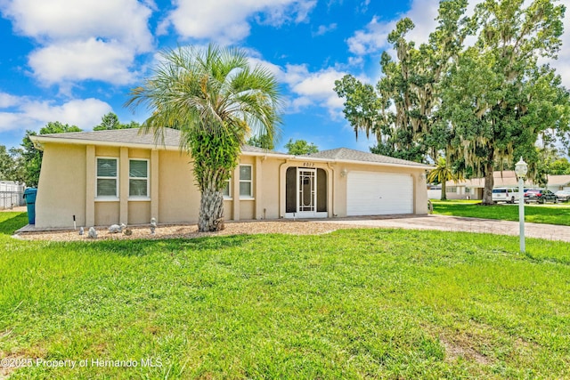 ranch-style house with a garage, stucco siding, concrete driveway, and a front lawn