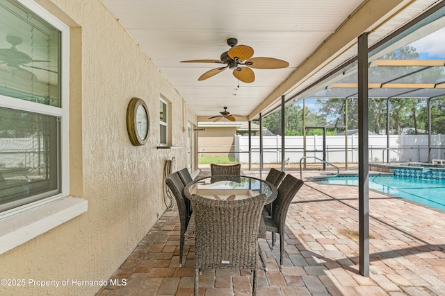 sunroom / solarium with a swimming pool