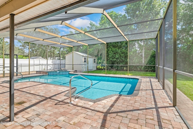 view of swimming pool featuring a patio, a fenced backyard, a shed, an outdoor structure, and a fenced in pool