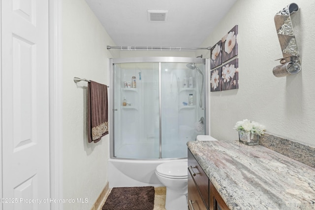 bathroom with vanity, toilet, visible vents, and combined bath / shower with glass door