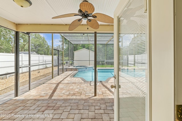 view of swimming pool featuring a pool with connected hot tub