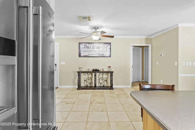 kitchen featuring visible vents, a ceiling fan, stainless steel fridge with ice dispenser, and crown molding