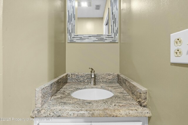 bathroom featuring visible vents and vanity