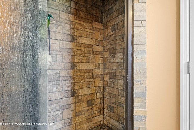 bathroom with tiled shower