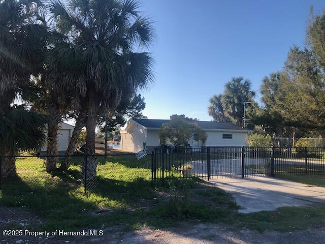 view of front of property with a gate and fence