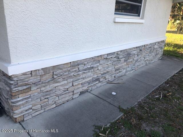 exterior details featuring stucco siding